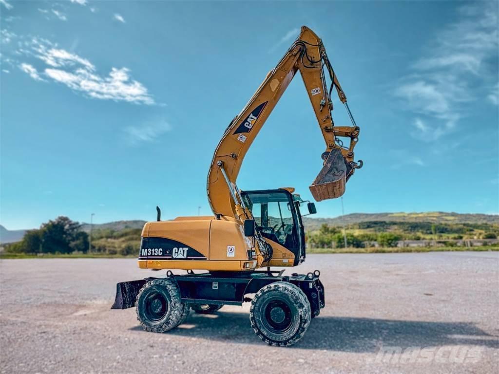 CAT M 313 C حفارات بعجل