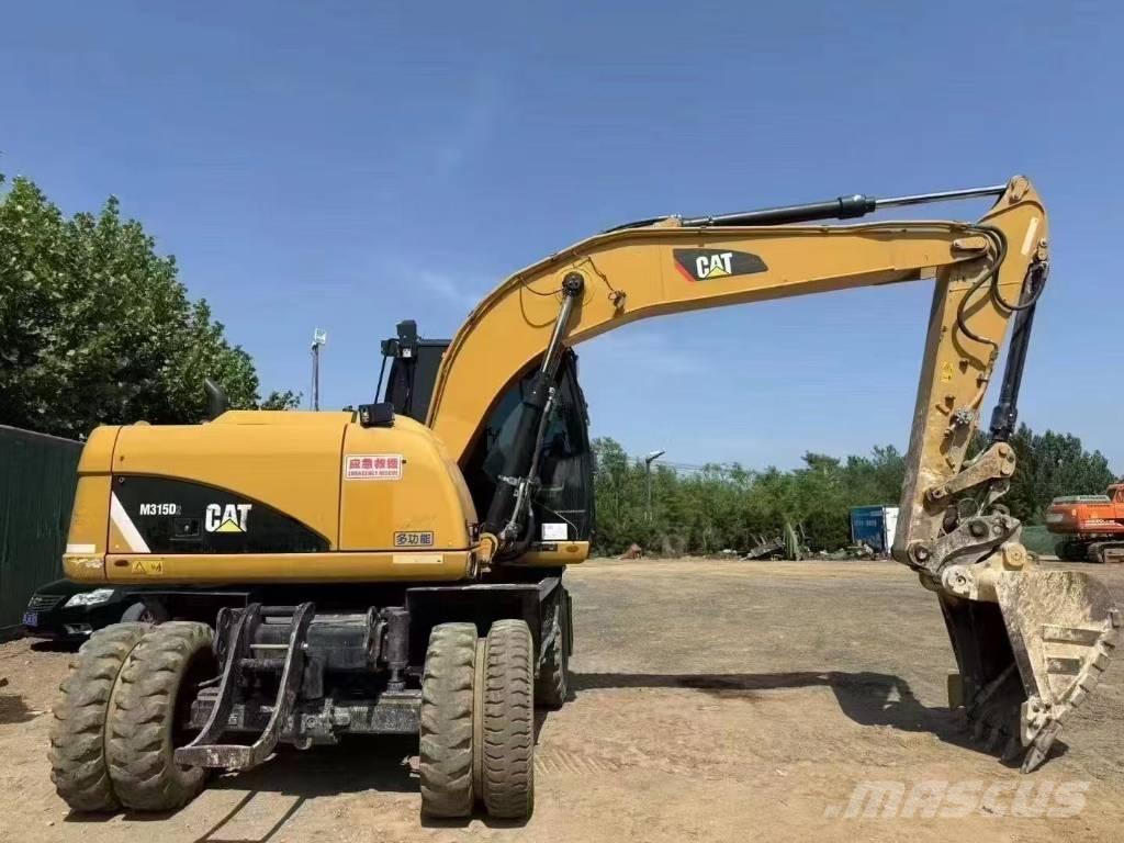 CAT M 315 D حفارات بعجل