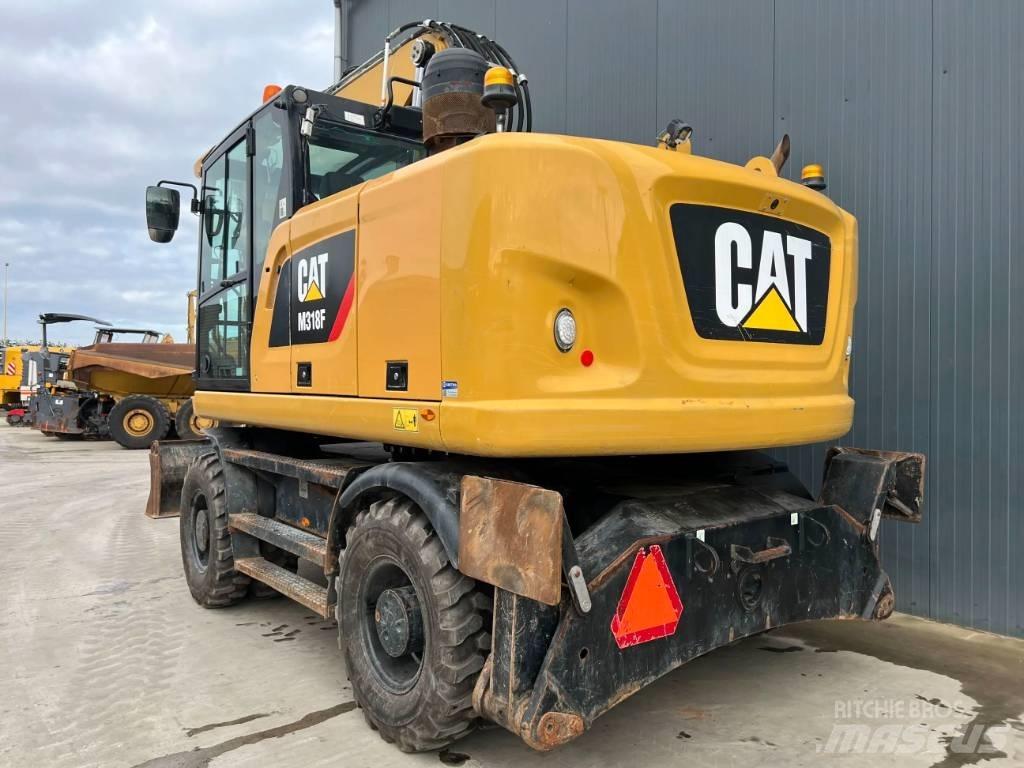 CAT M318F حفارات بعجل