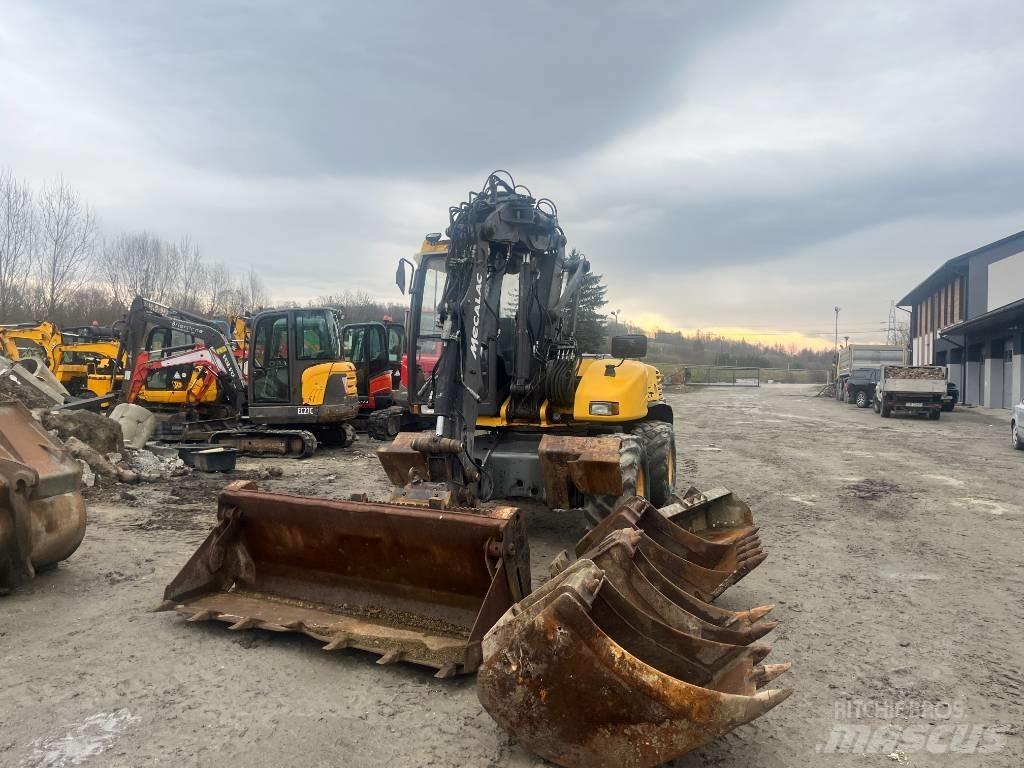 Mecalac 12 M XT حفارات بعجل