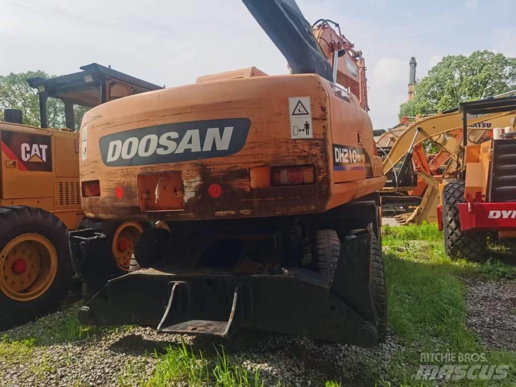 Doosan DH 210 W حفارات بعجل