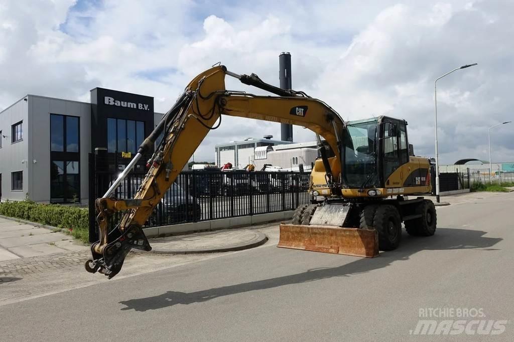 CAT M313 D حفارات بعجل