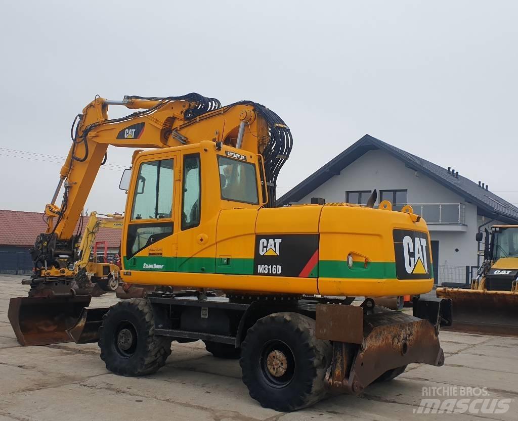 CAT M 316 D حفارات بعجل