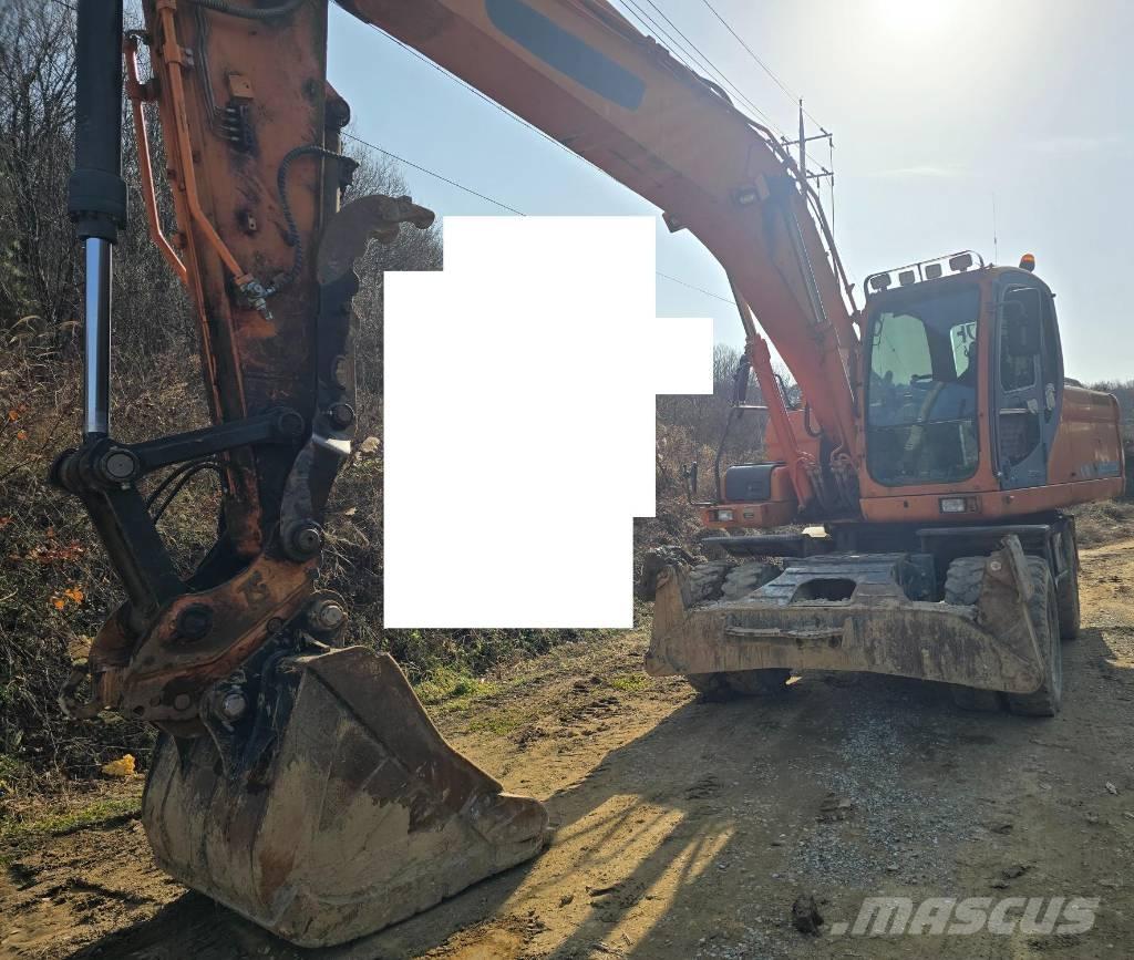 Doosan DX 210 W حفارات بعجل