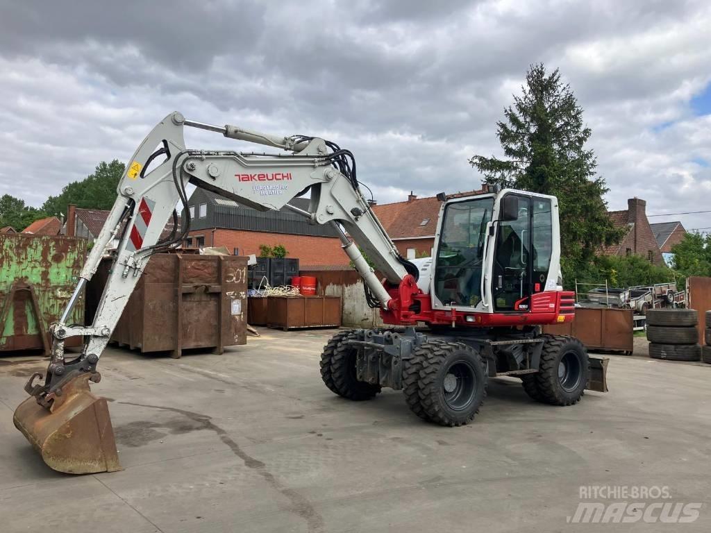 Takeuchi TB 295 W حفارات بعجل
