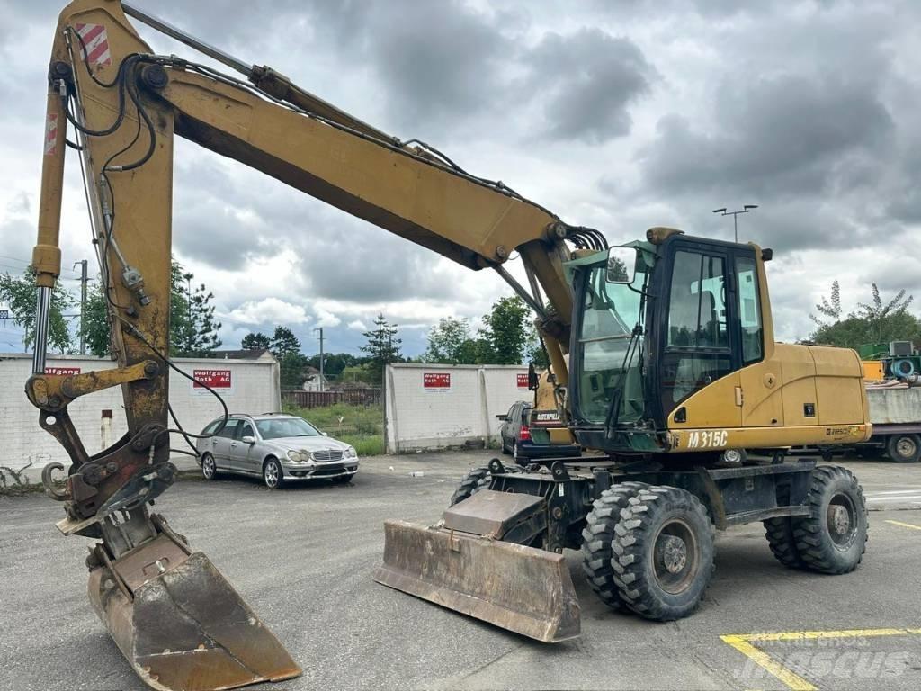 CAT 315 C حفارات بعجل