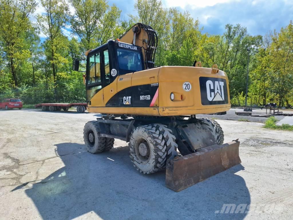 CAT M 315 D حفارات بعجل