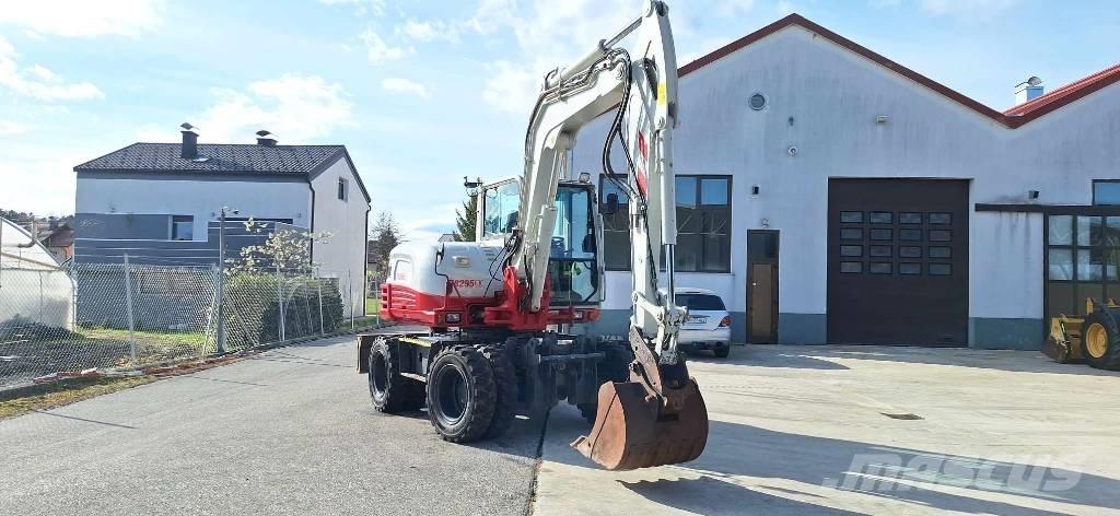 Takeuchi TB 295 W حفارات بعجل