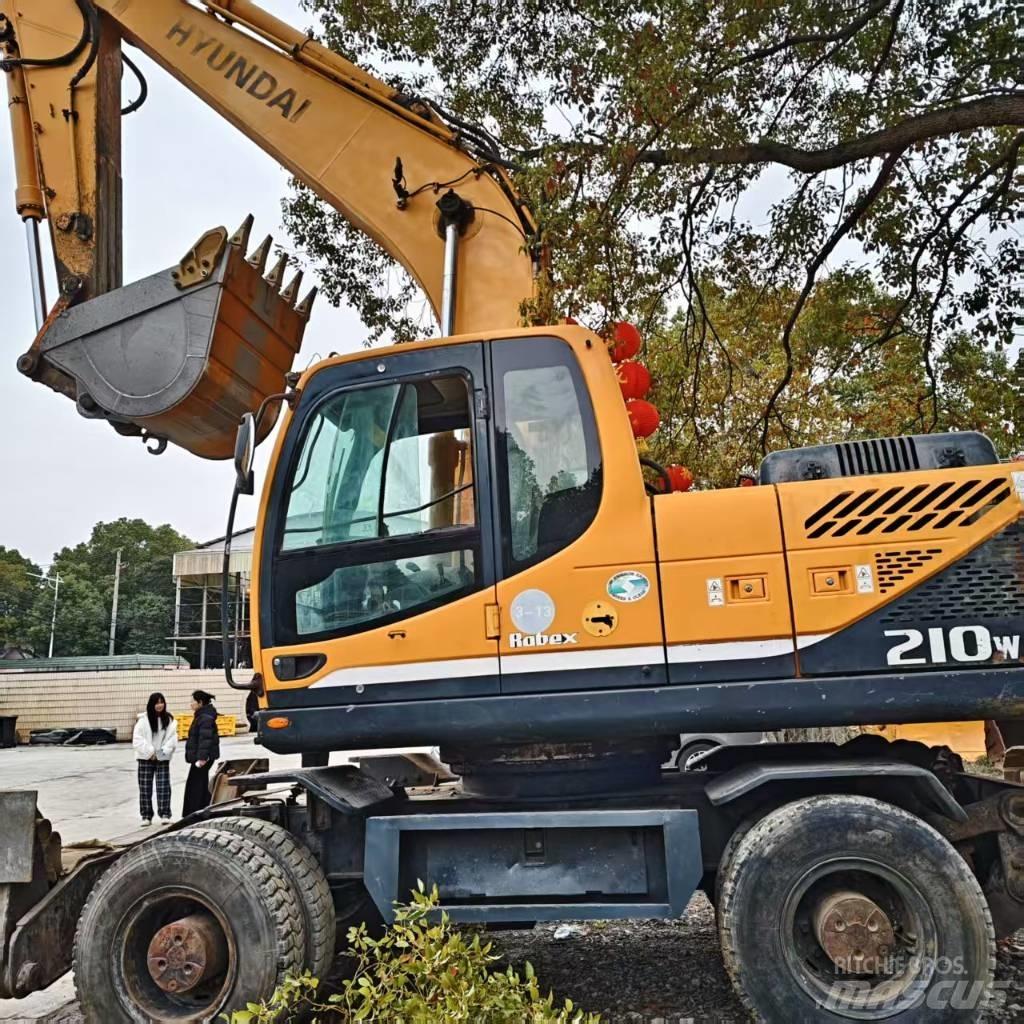 Hyundai 210w-9 حفارات بعجل
