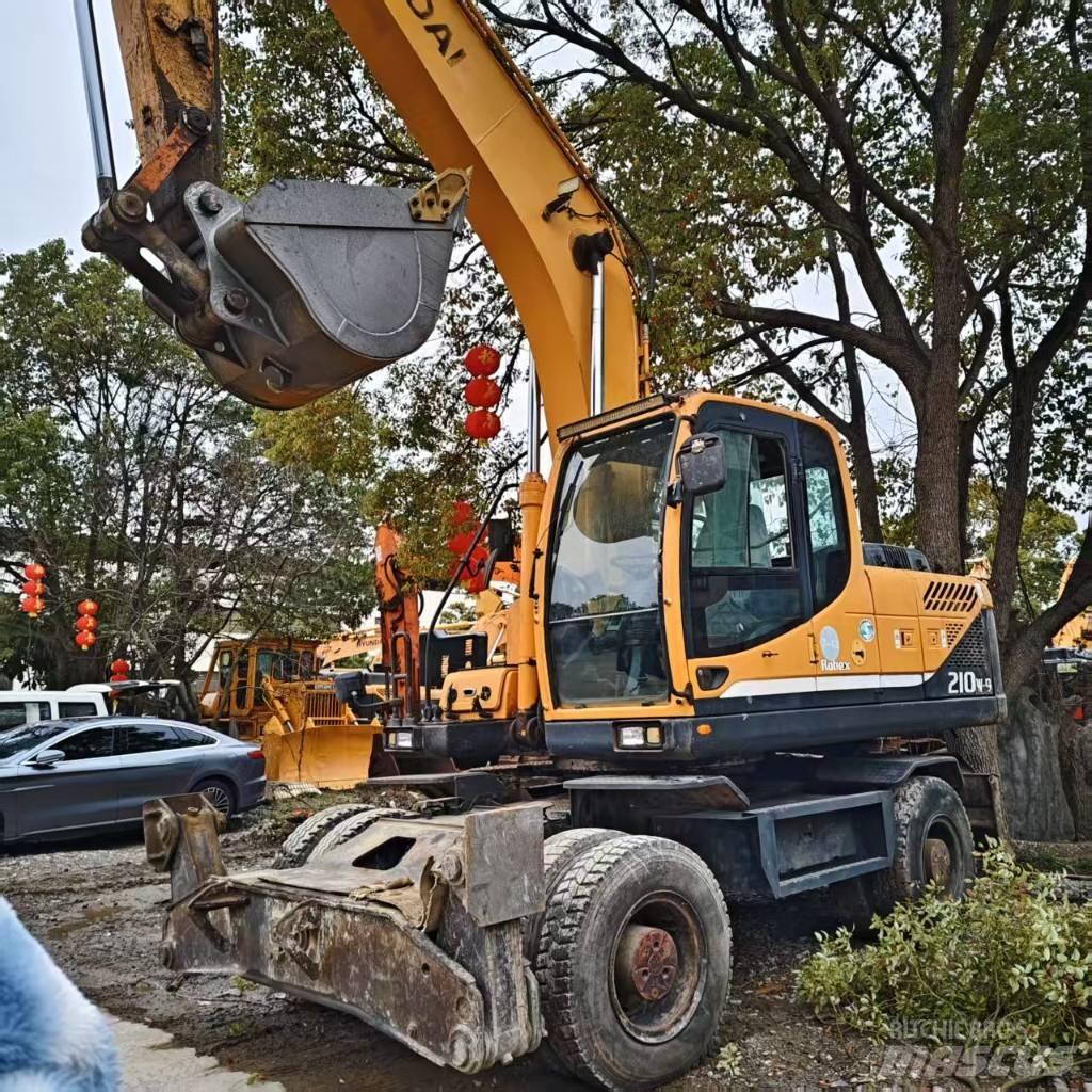 Hyundai 210w-9 حفارات بعجل