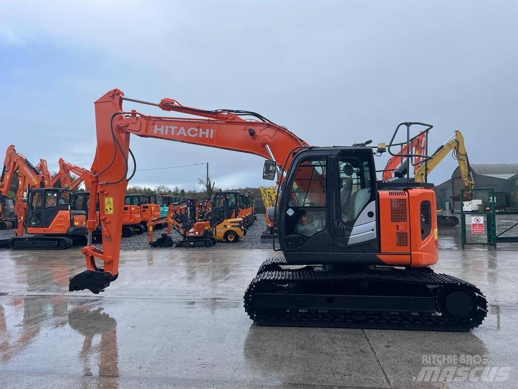 Hitachi ZX 135 US-6 حفارات زحافة