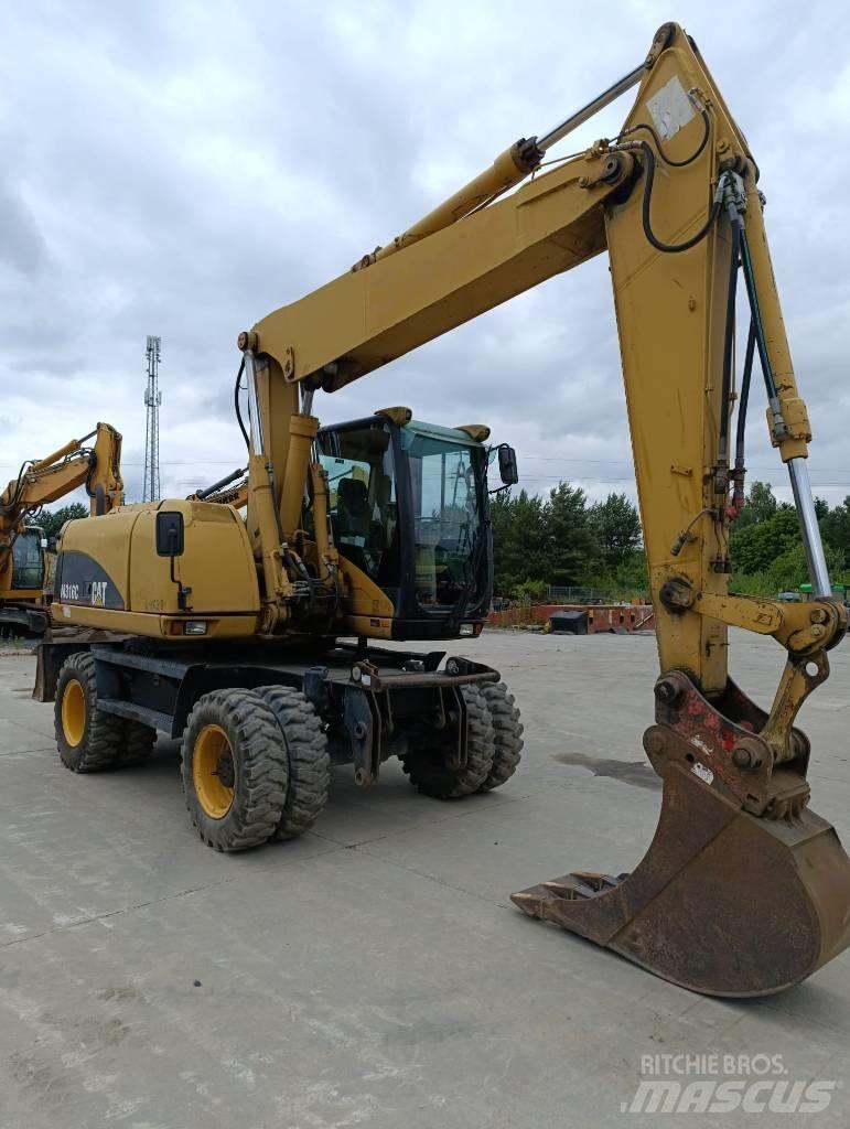 CAT M 316 C حفارات بعجل