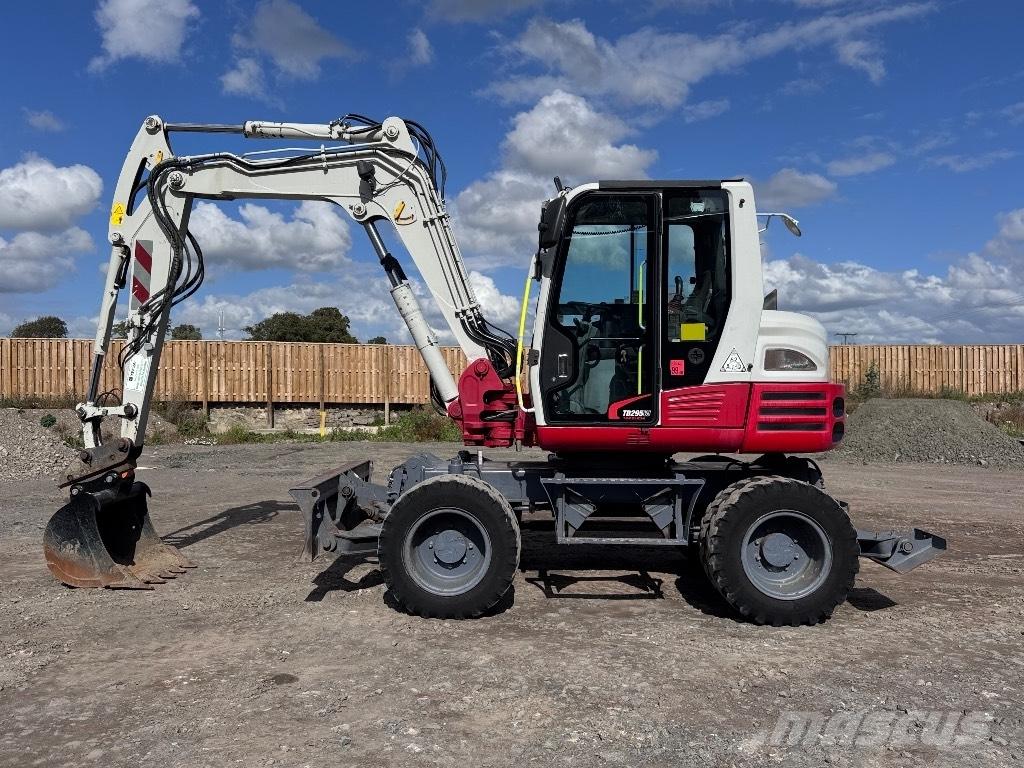 Takeuchi TB 295 W حفارات بعجل