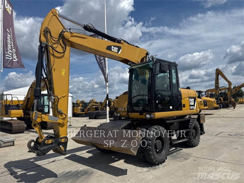 CAT M313D حفارات بعجل