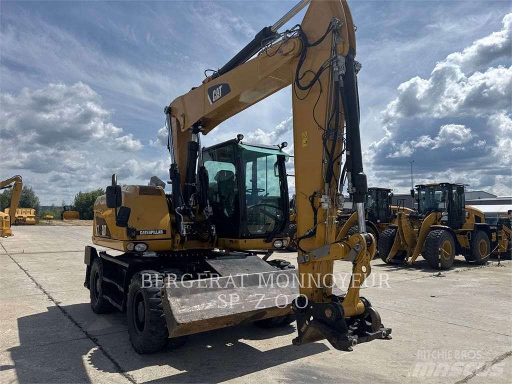 CAT M313D حفارات بعجل