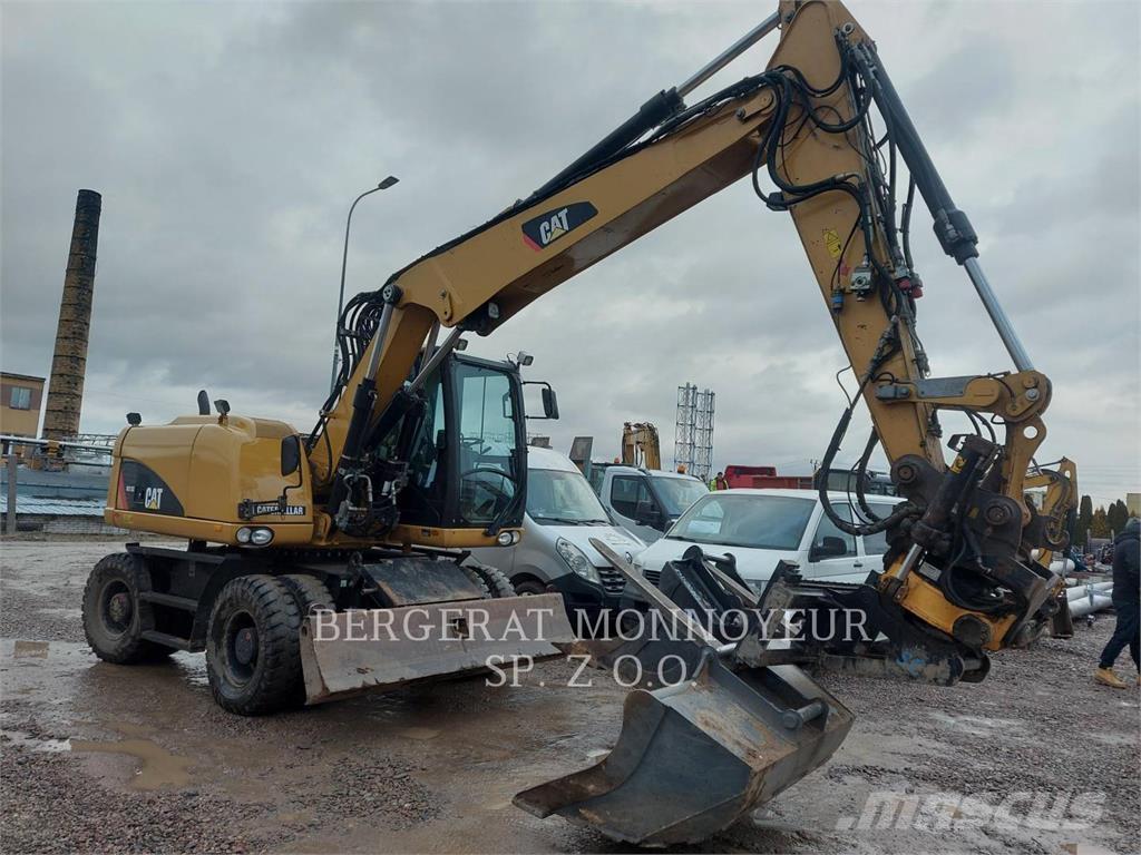 CAT M313D حفارات بعجل