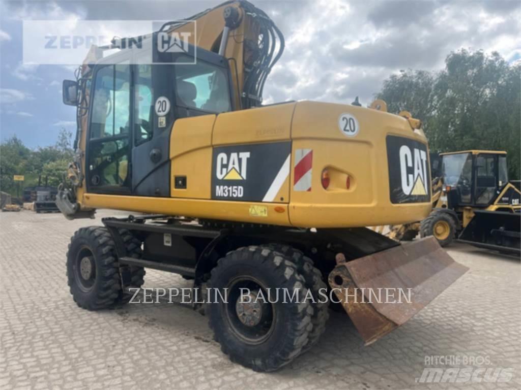 CAT M315D حفارات بعجل