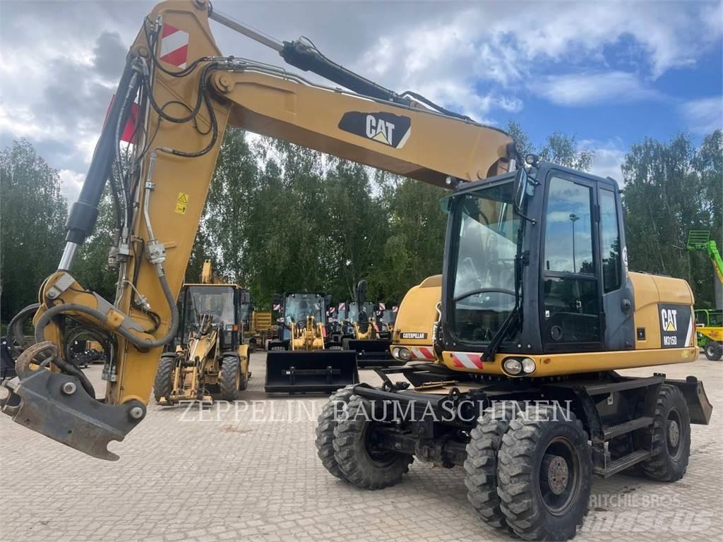 CAT M315D حفارات بعجل