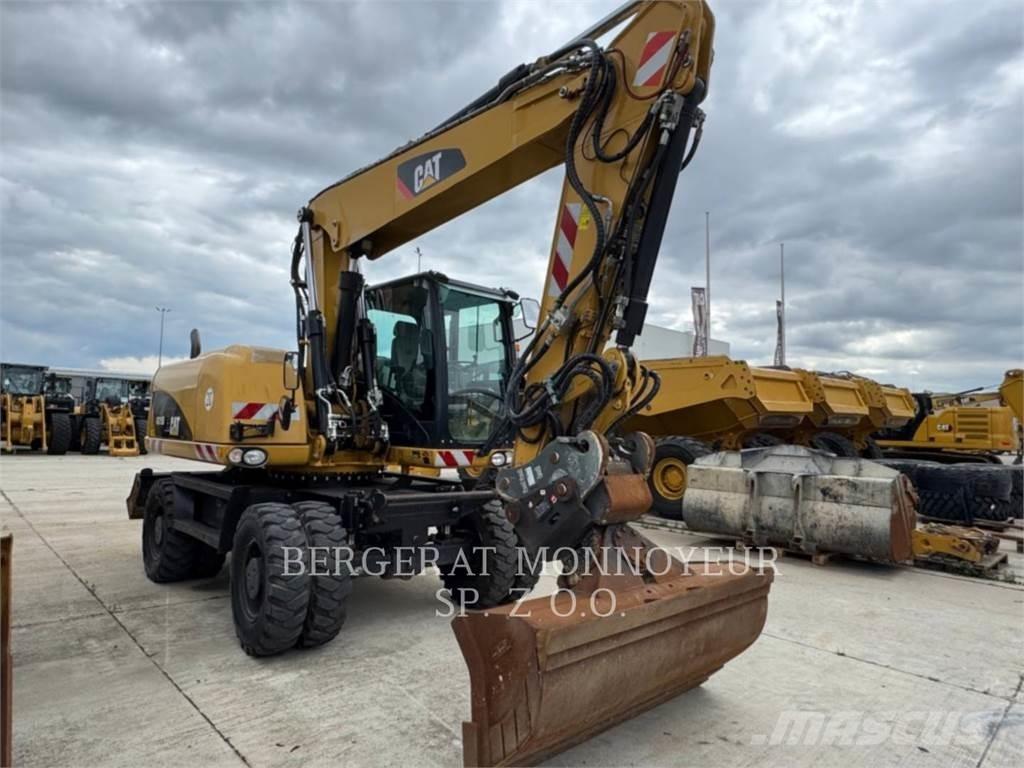 CAT M315D حفارات بعجل