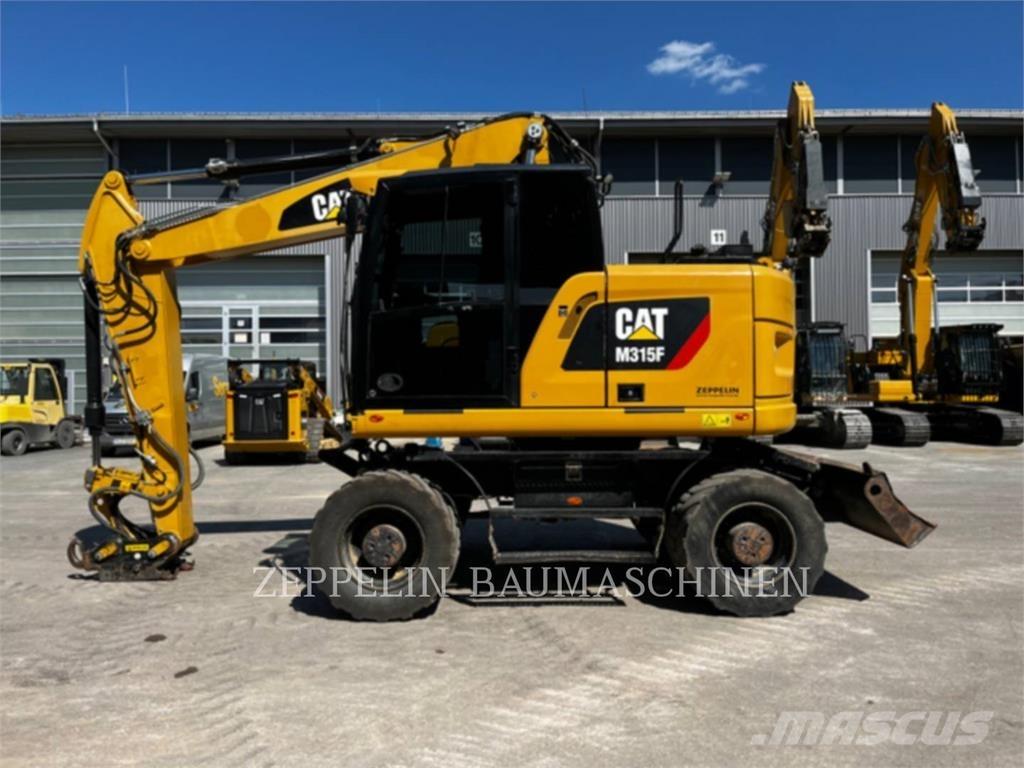 CAT M315F حفارات بعجل