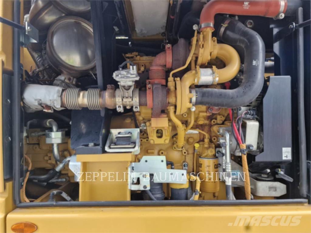 CAT M315F حفارات بعجل