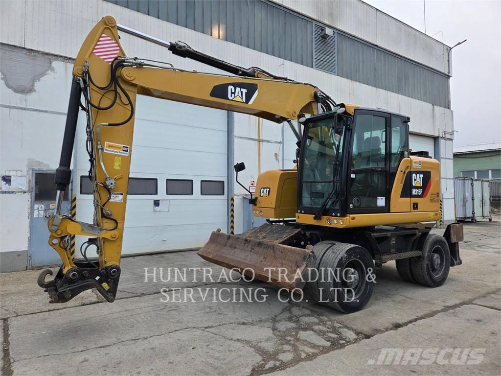 CAT M315F حفارات بعجل