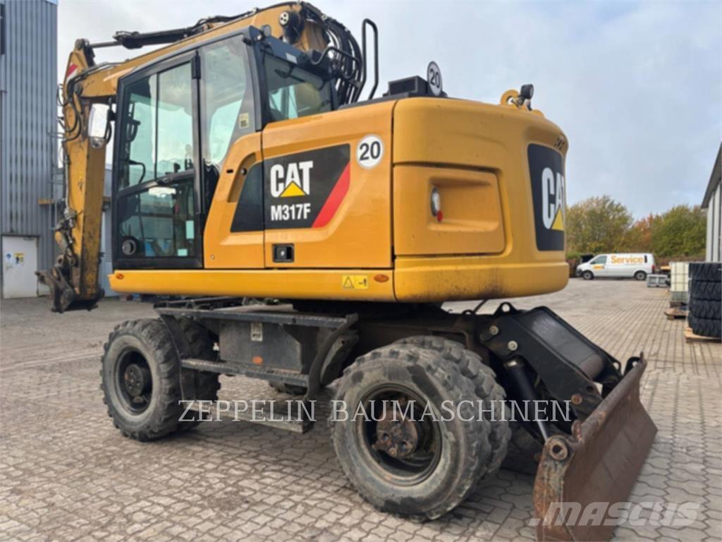 CAT M317F حفارات بعجل