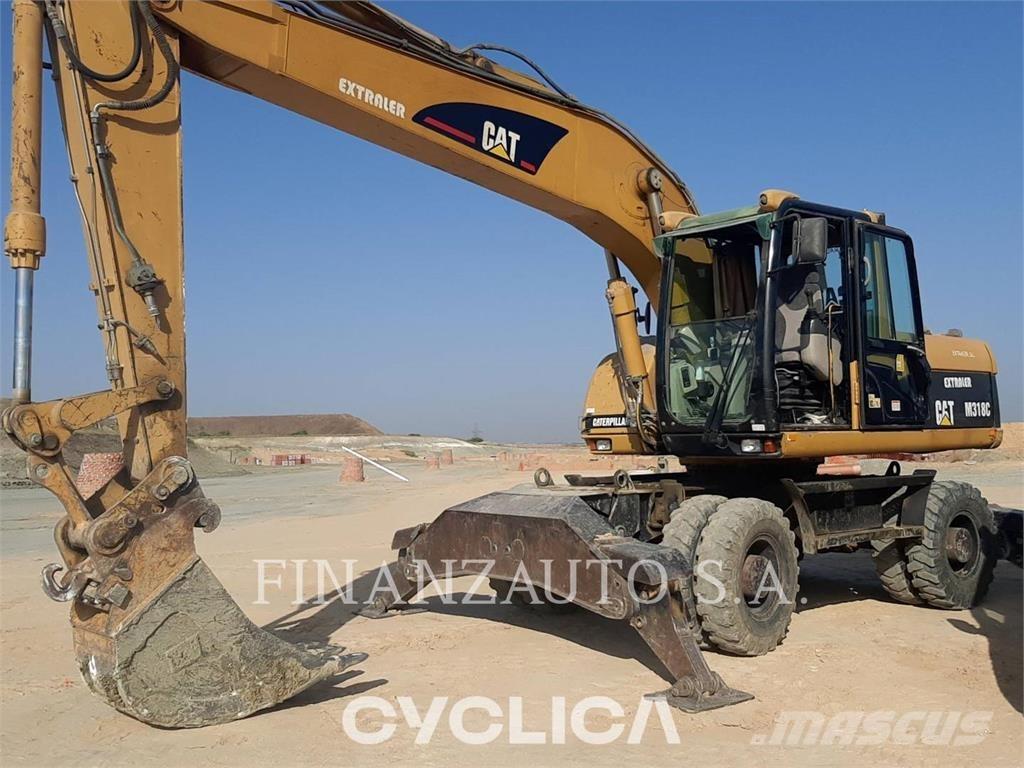 CAT M318 حفارات بعجل