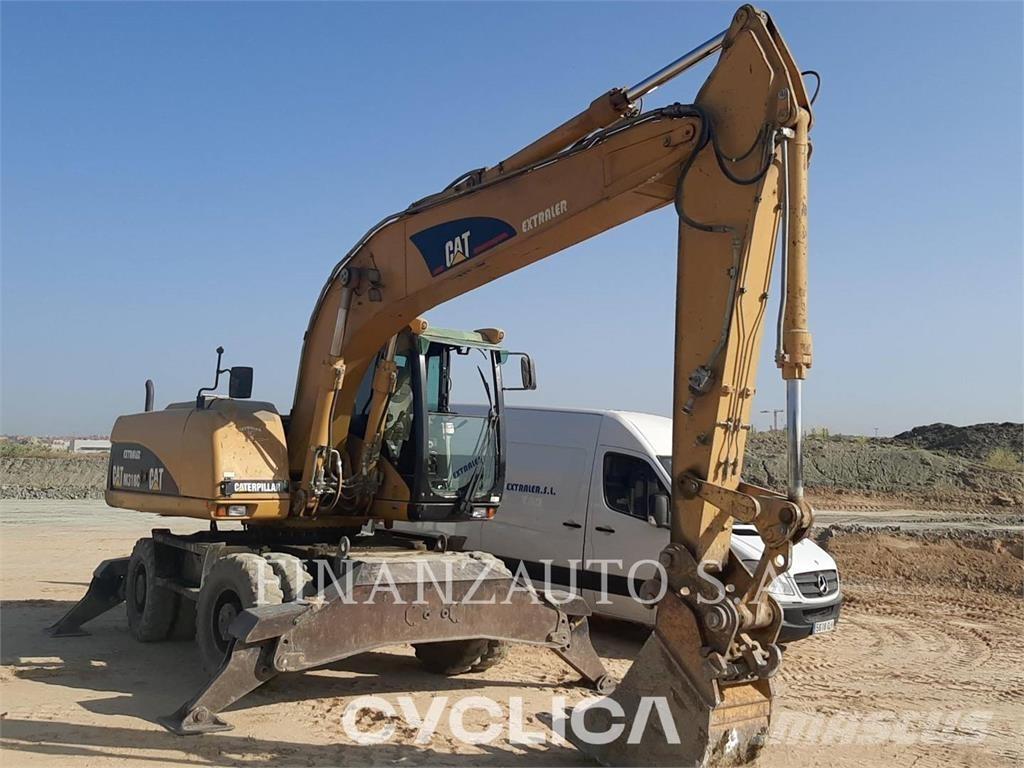 CAT M318 حفارات بعجل
