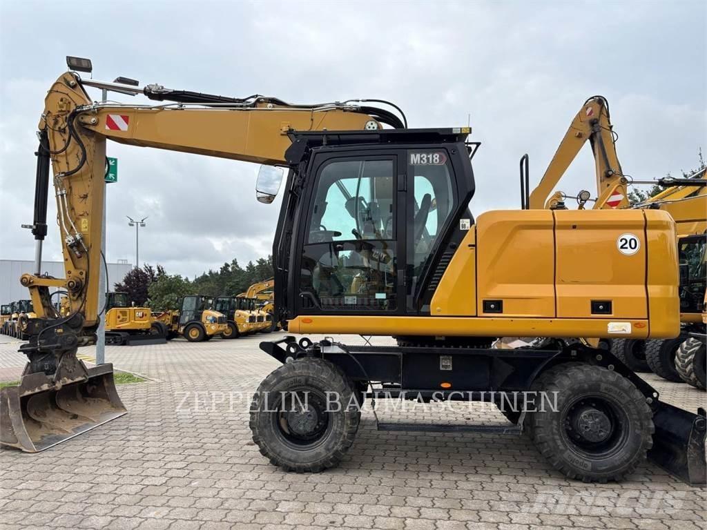 CAT M318-07A حفارات بعجل