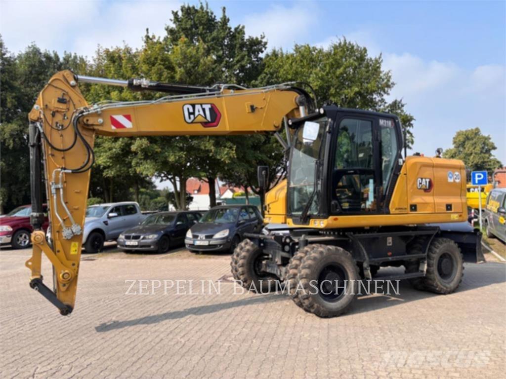 CAT M318-07A حفارات بعجل