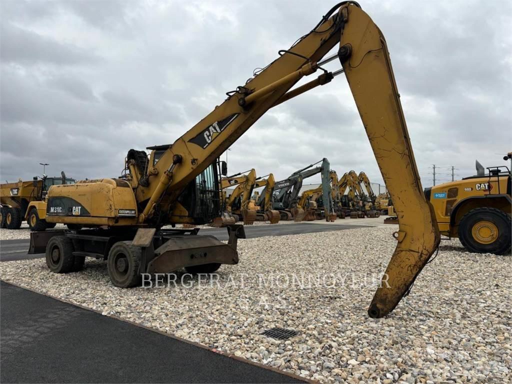 CAT M318C حفارات بعجل