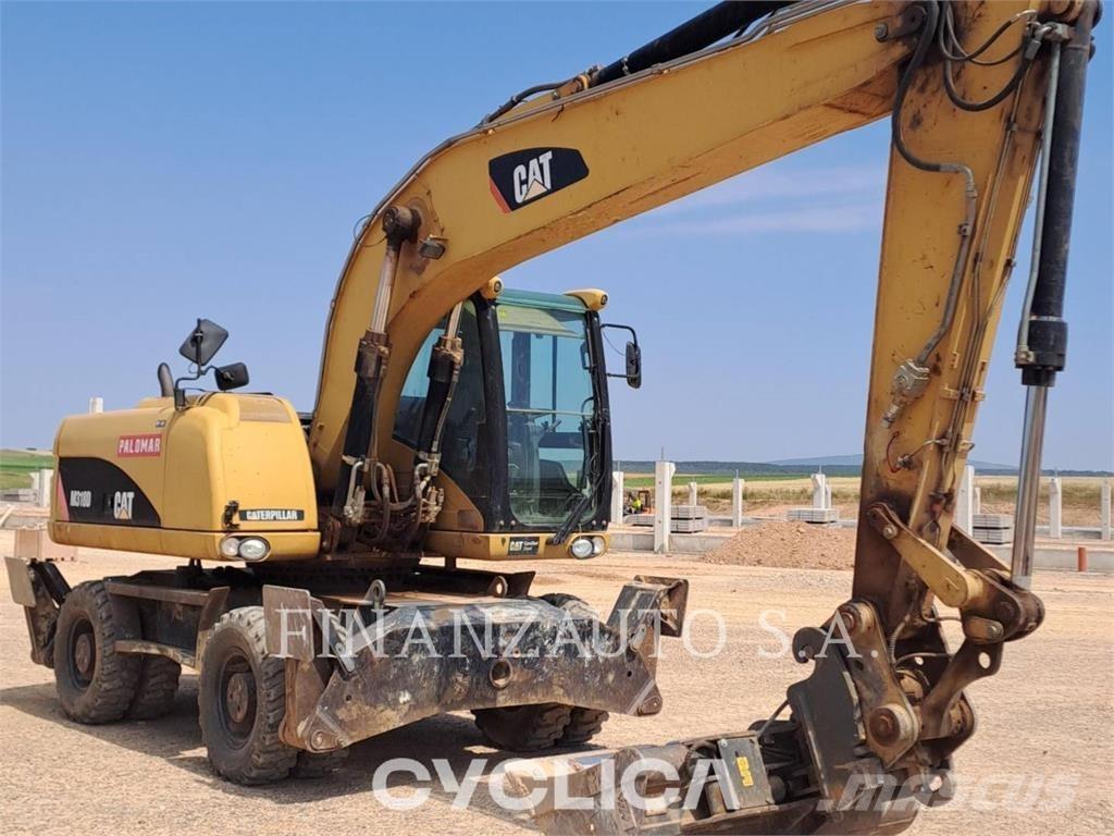 CAT M318D حفارات بعجل
