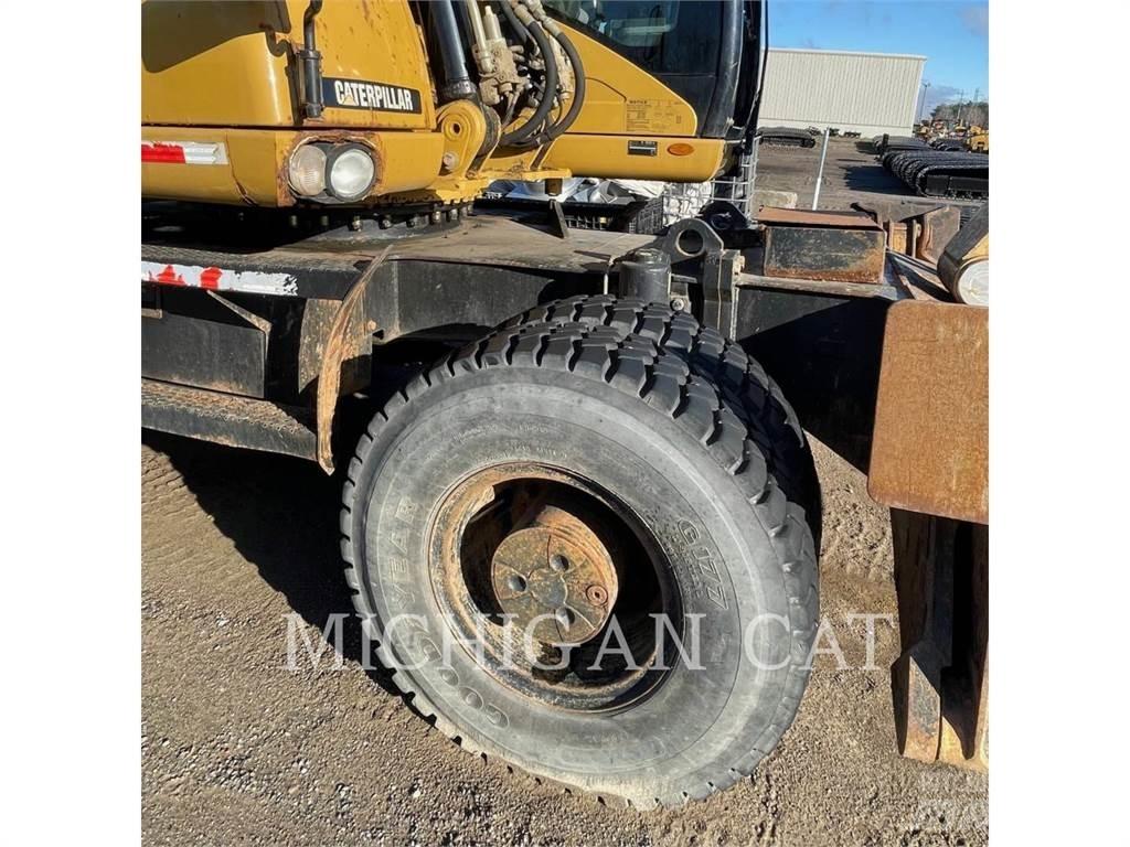 CAT M318D PM حفارات بعجل
