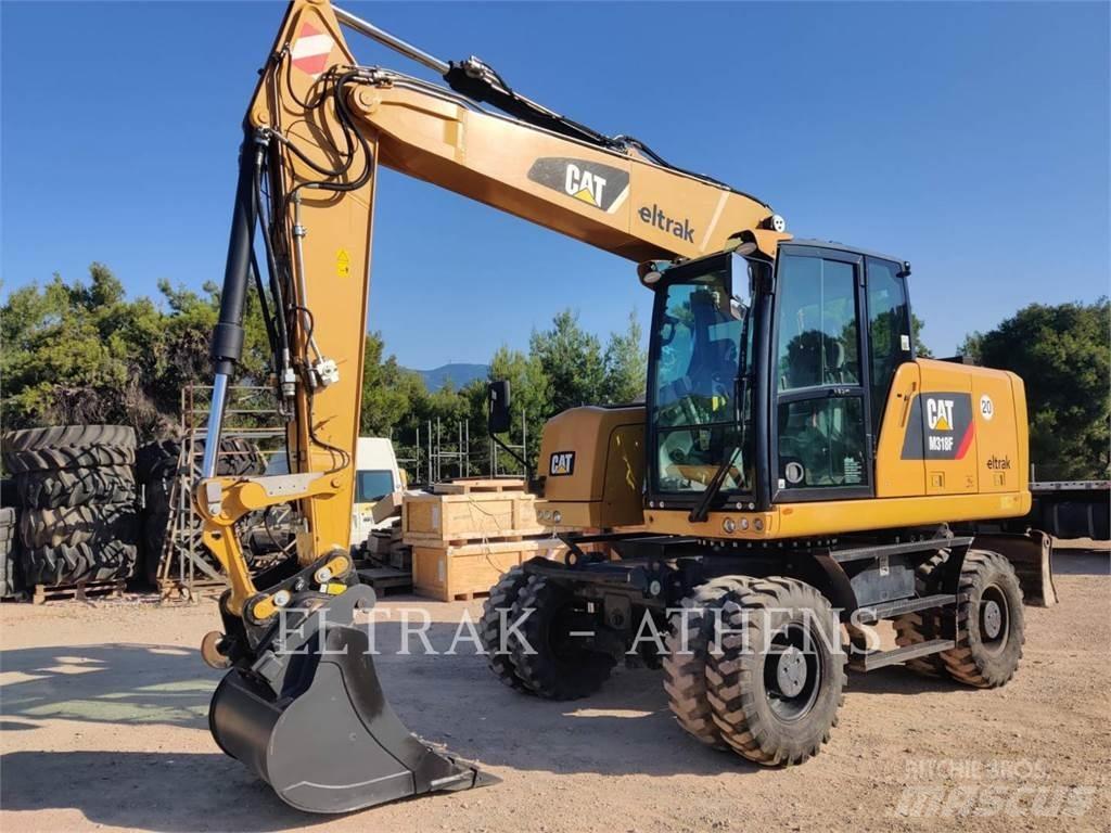 CAT M318F حفارات بعجل