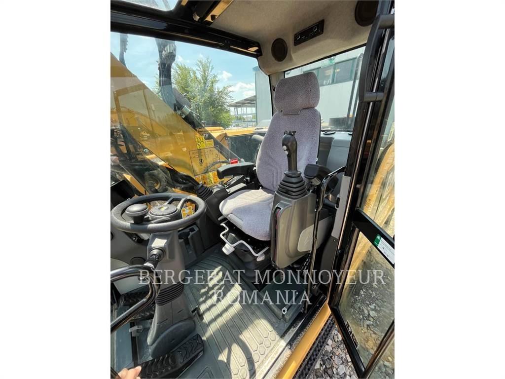 CAT M318F حفارات بعجل