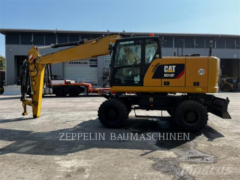 CAT M318F حفارات بعجل