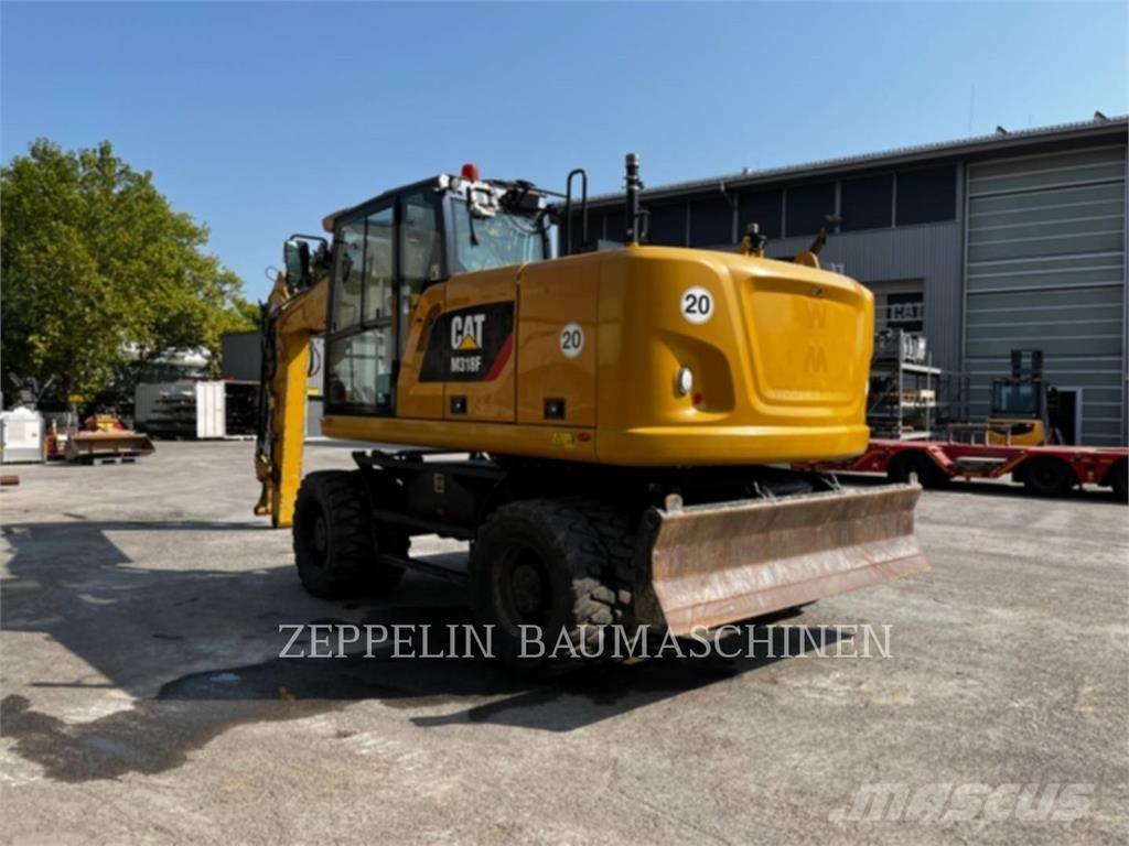 CAT M318F حفارات بعجل