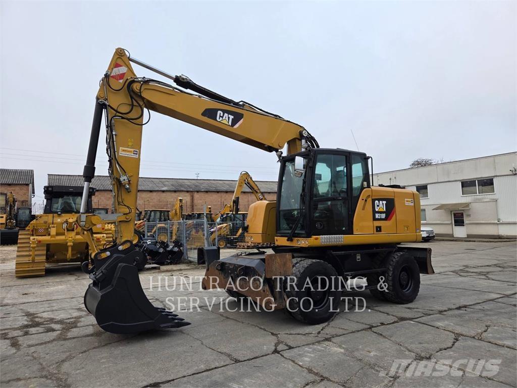 CAT M318F حفارات بعجل