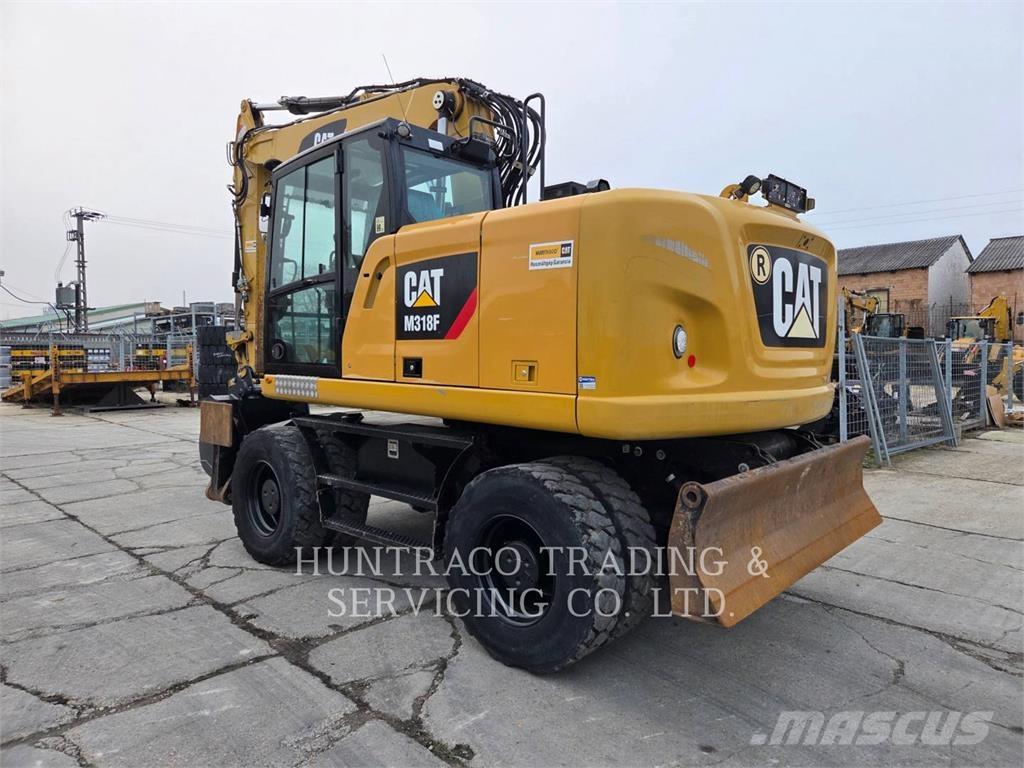 CAT M318F حفارات بعجل