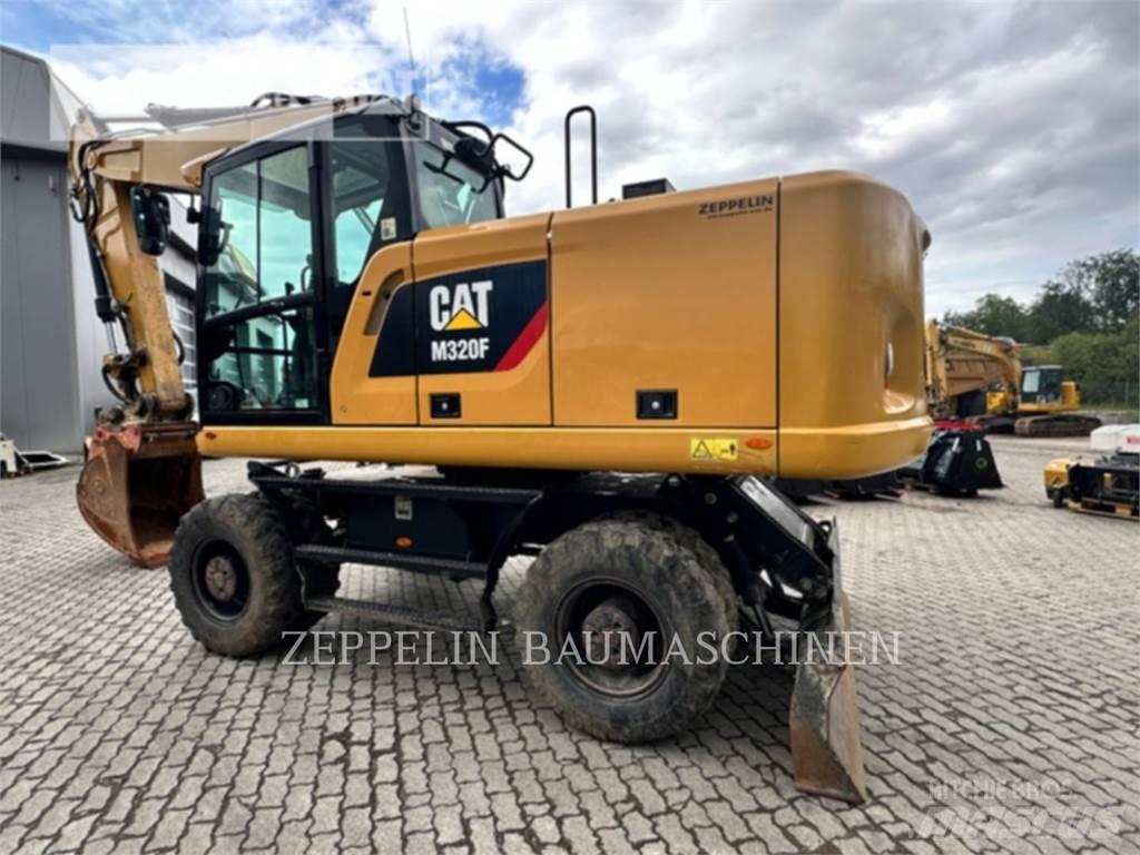 CAT M320F حفارات بعجل