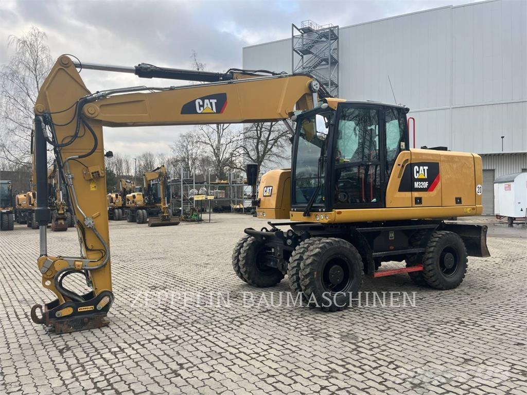 CAT M320F حفارات بعجل