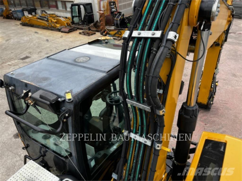 CAT M320F حفارات بعجل