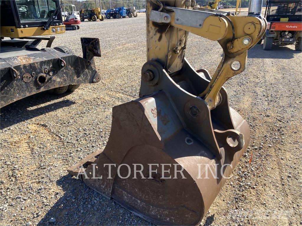 CAT M320F حفارات بعجل