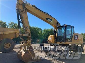 CAT M320FL حفارات بعجل