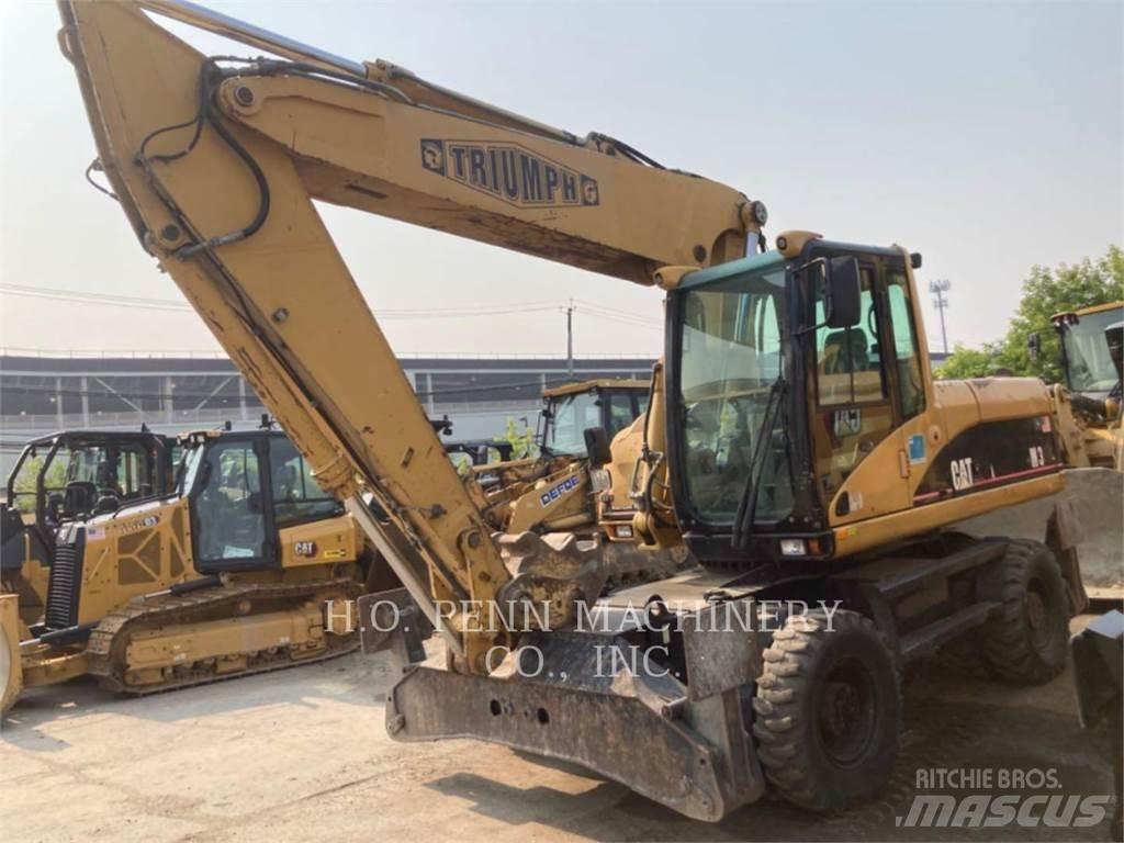 CAT M322C حفارات بعجل