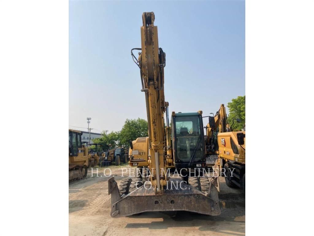 CAT M322C حفارات بعجل