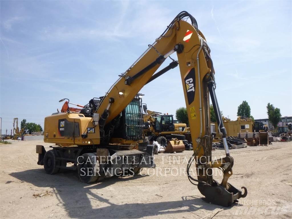 CAT MH3022-06 حفارات بعجل