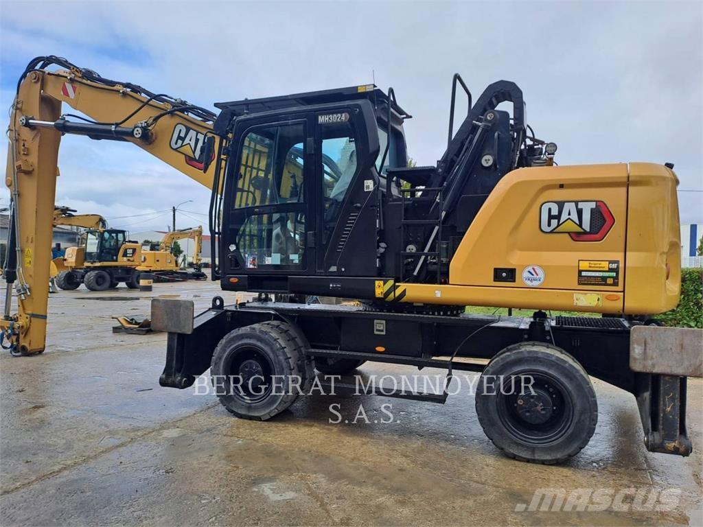 CAT MH3024 حفارات بعجل