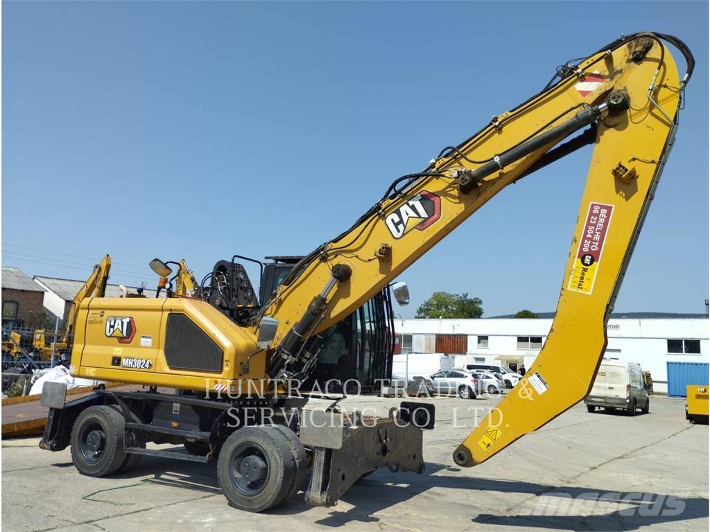 CAT MH3024-07 حفارات بعجل